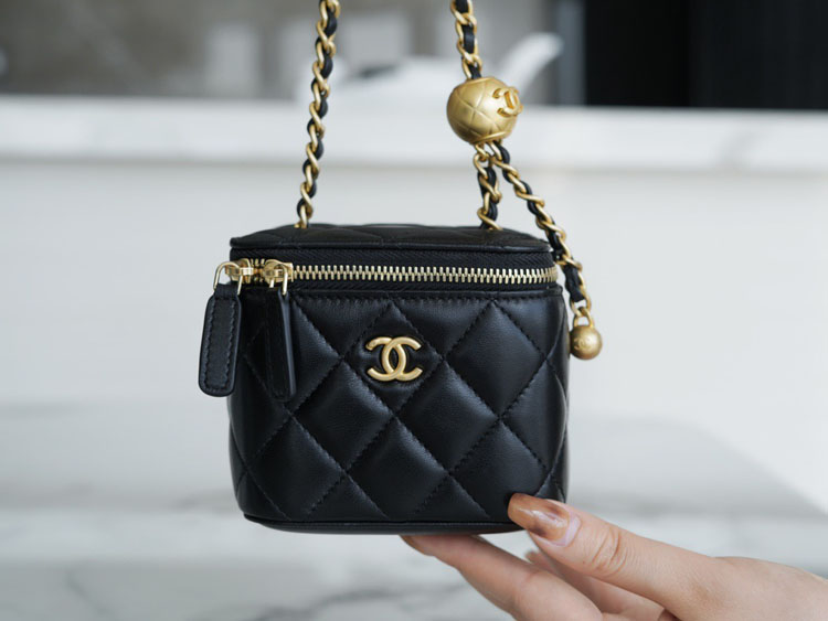 Chane* Mini black gold pouch bag